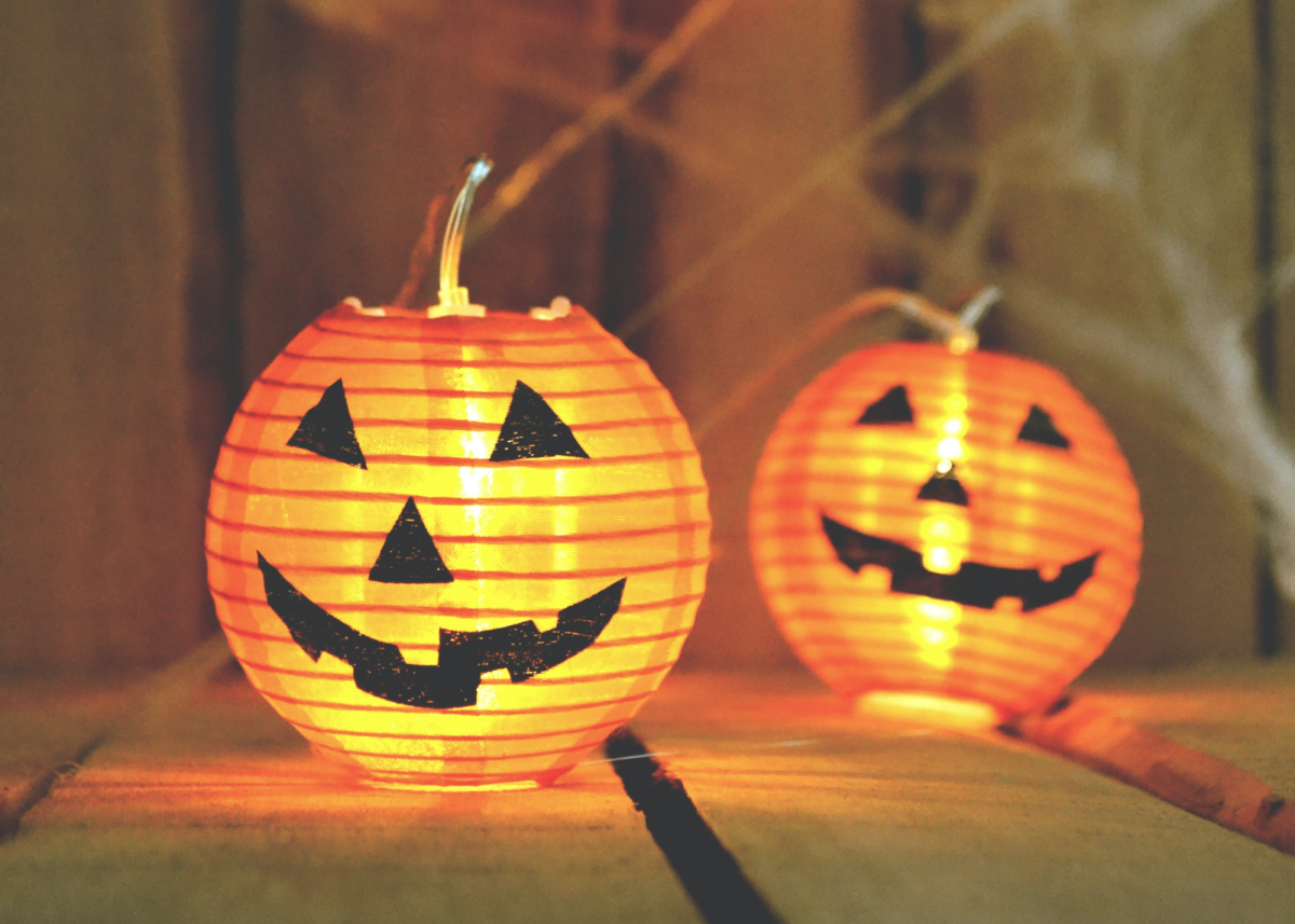 Add faces to orange paper lanterns to create super-easy pumpkin lanterns!