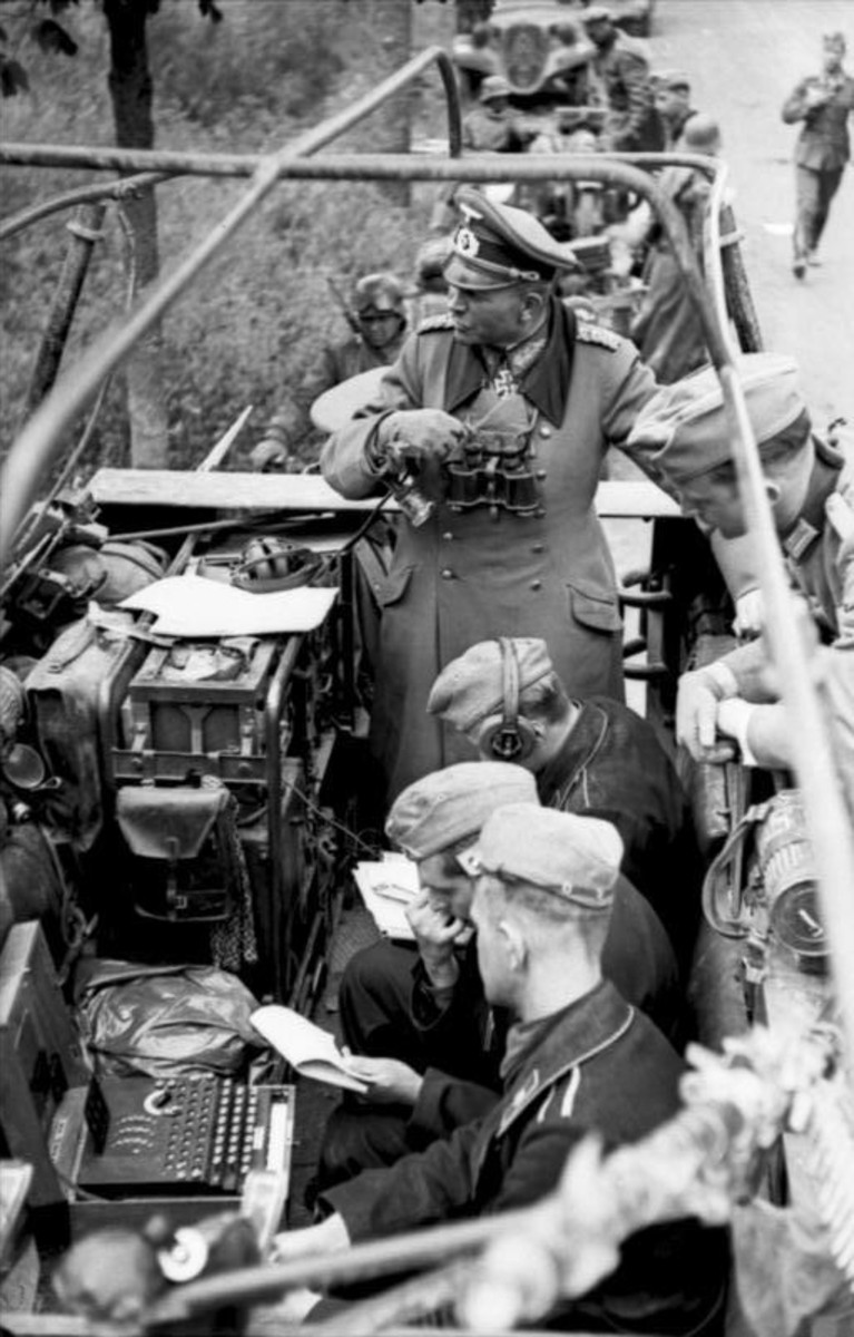 Guderian with an Enigma machine in a half-track being used as a mobile command center during the Battle of France, 1940. Commanding his armored fist from the front led to the German sucess in the battle for France.
