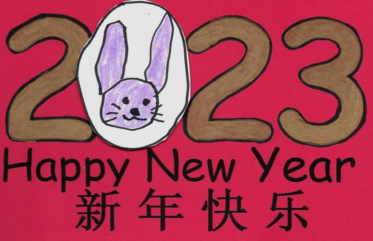 Red is the traditional color for Chinese New Year, so this has been printed onto red card stock. The child drew the rabbit onto white card stock, colored it, cut it out, and glued it to the card.