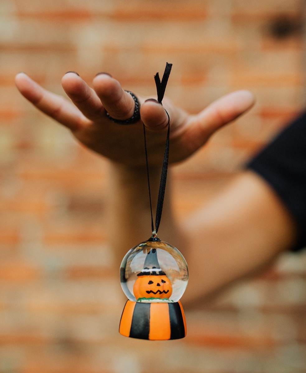 Use Halloween ornaments to hang on a tabletop tree or dangle from candlesticks on your dining room table.