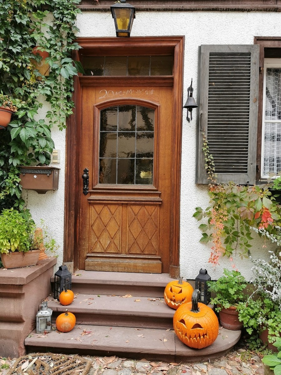 Keep your doorstep simple to attract passing ghosts and goblins. Too much clutter is messy and may cause accidents.