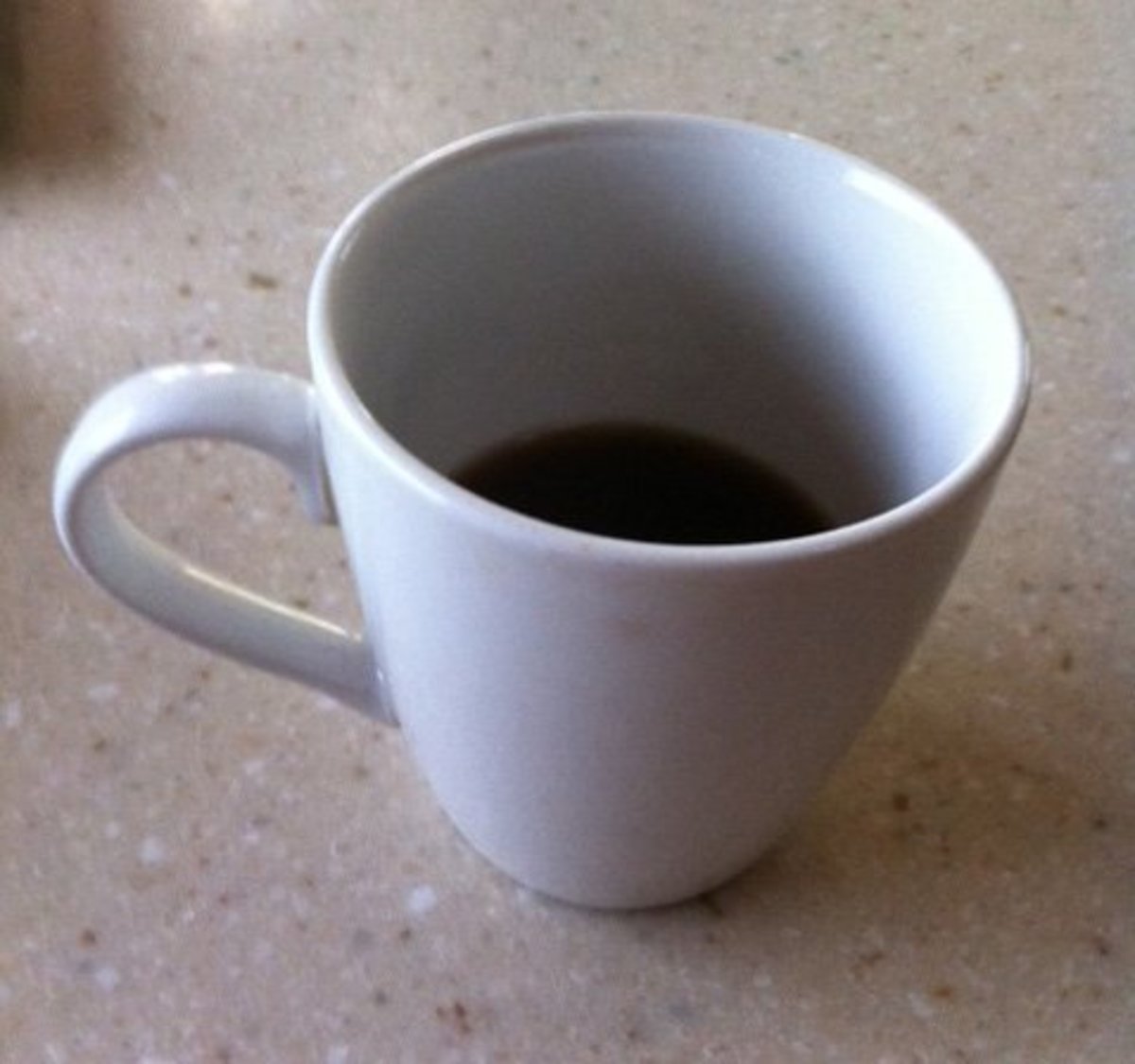 Coffee Cup with coffee in it.