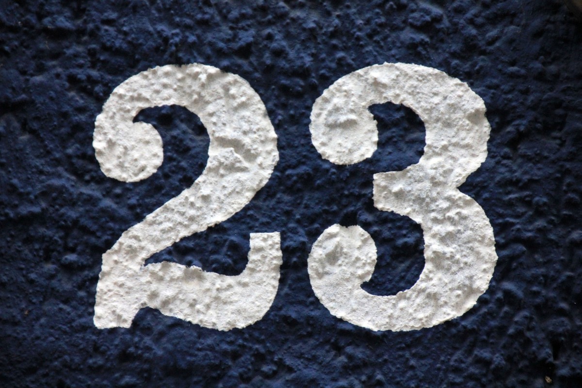 The number 23 symbolizing the 23rd episode of the original Inspector Gadget.