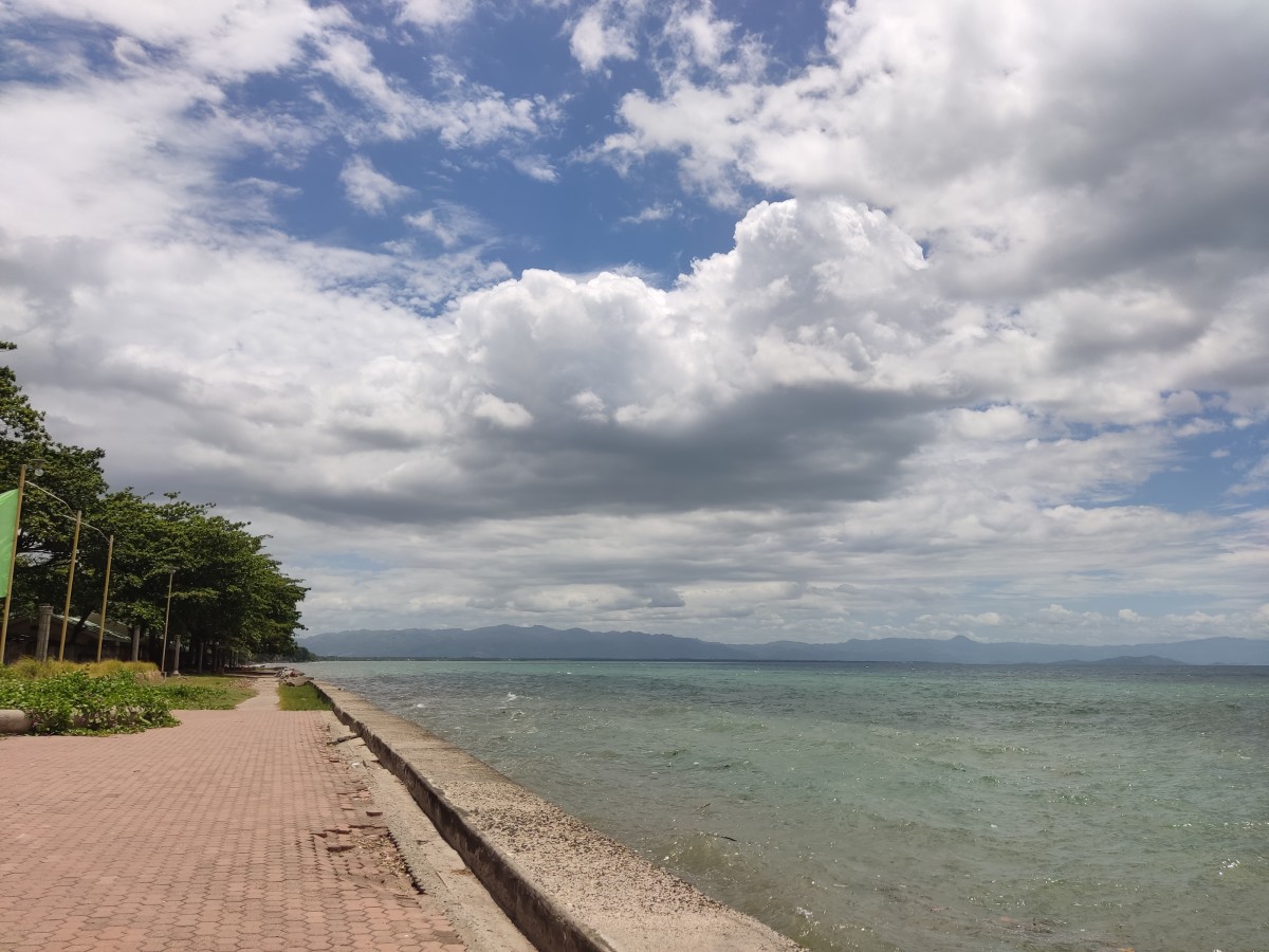 A portion of the beachfront in Poblacion, Amlan, Negros Oriental on a cloudy day. Amlan is a lesser known coastal town in the Philippines, and is worth a visit.