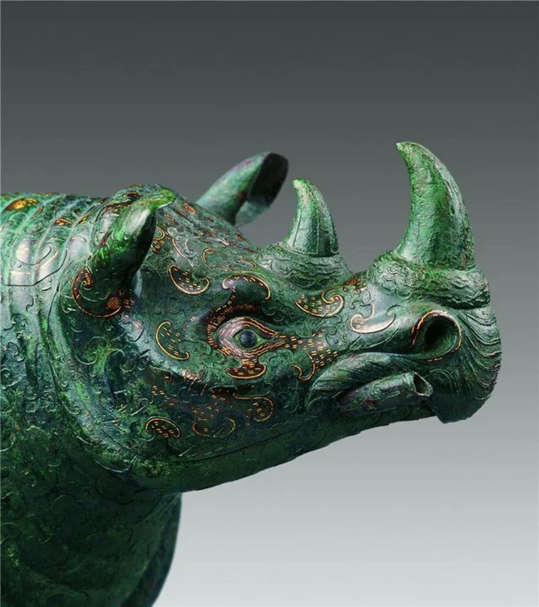 Bronze rhinoceros inlaid with moire of gold and silver.  Western Han Dynasty, 206 BC-8 AD