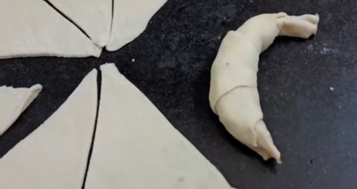 Roll the dough into a crescent shape.