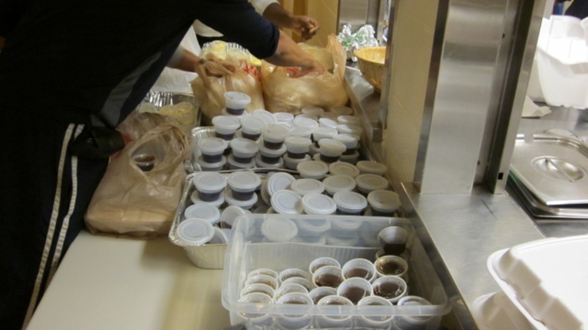 Condiment cups are filled for the carryouts.