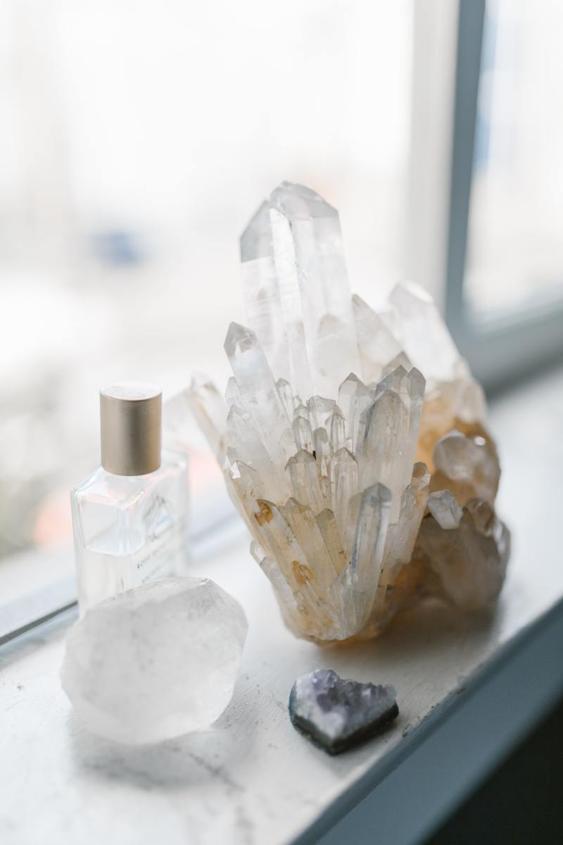 Cluster of quartz sits on a windowsill.