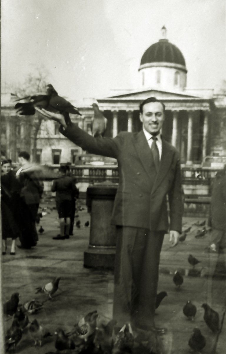 Dad feeding pigeons in Trafalgar Square.