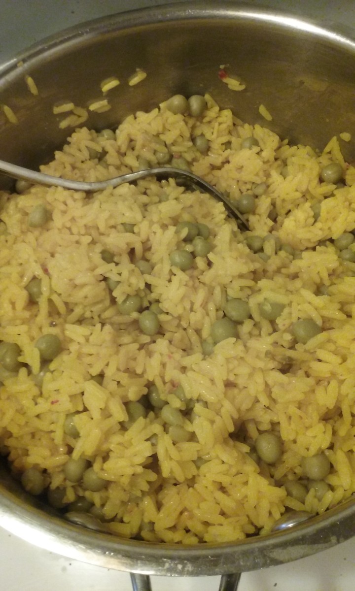 Yellow rice is very enjoyable and it pairs well with green peas.