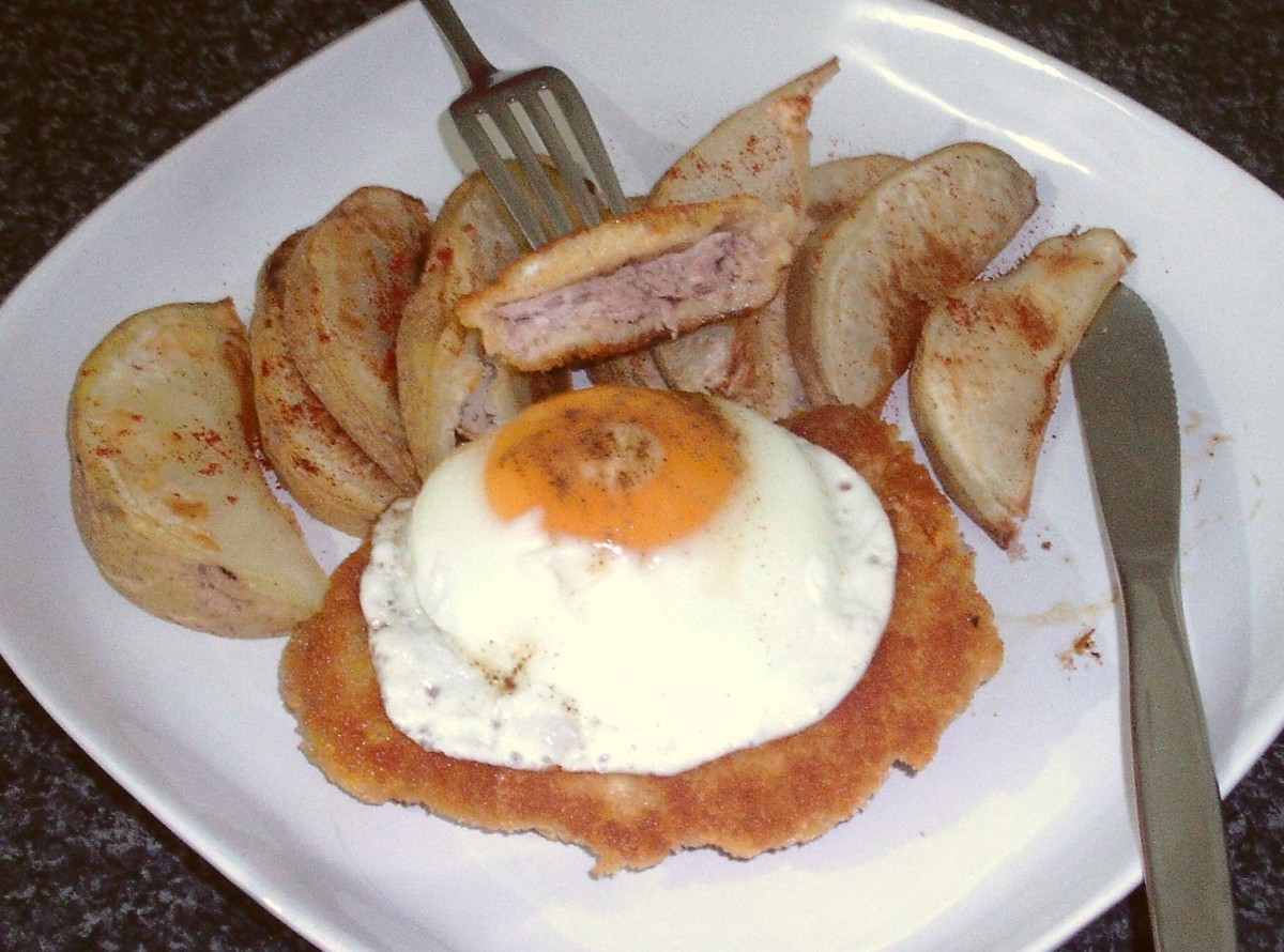 Pheasant shnitzel with fried egg and spicy potato wedges