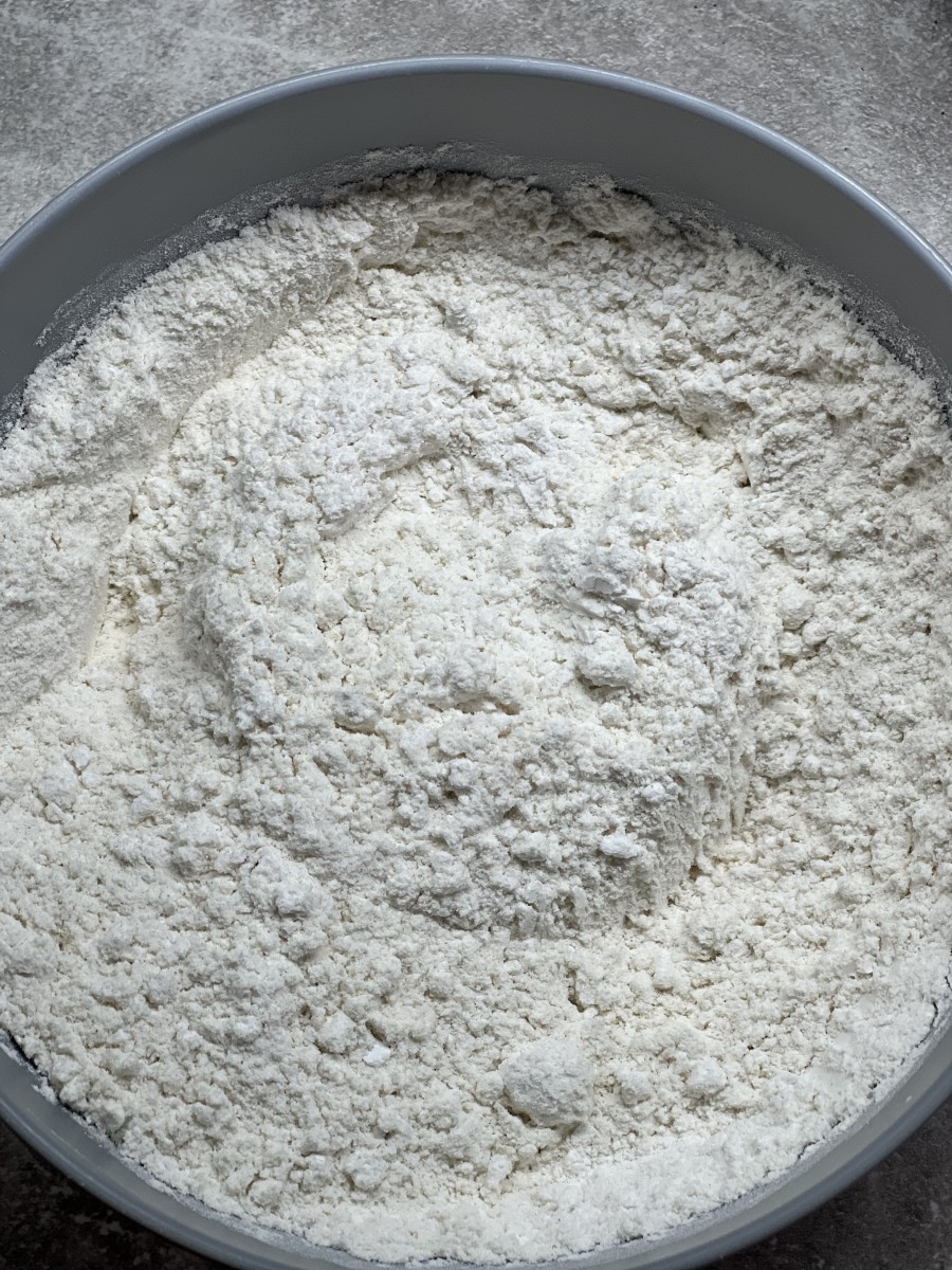 Combine the two types of flour, baking soda, baking powder, and salt in separate bowl.