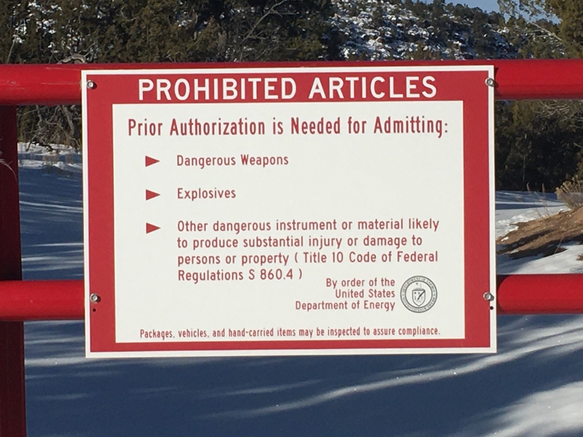Prohibited Articles warning sign at the perimeter fence of the National Laboratories in Los Alamos, New Mexico.  You will see numerous signs like these on your way to Bandelier.