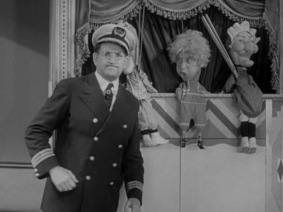 Harpo cutting up during the famous Punch and Judy scene.