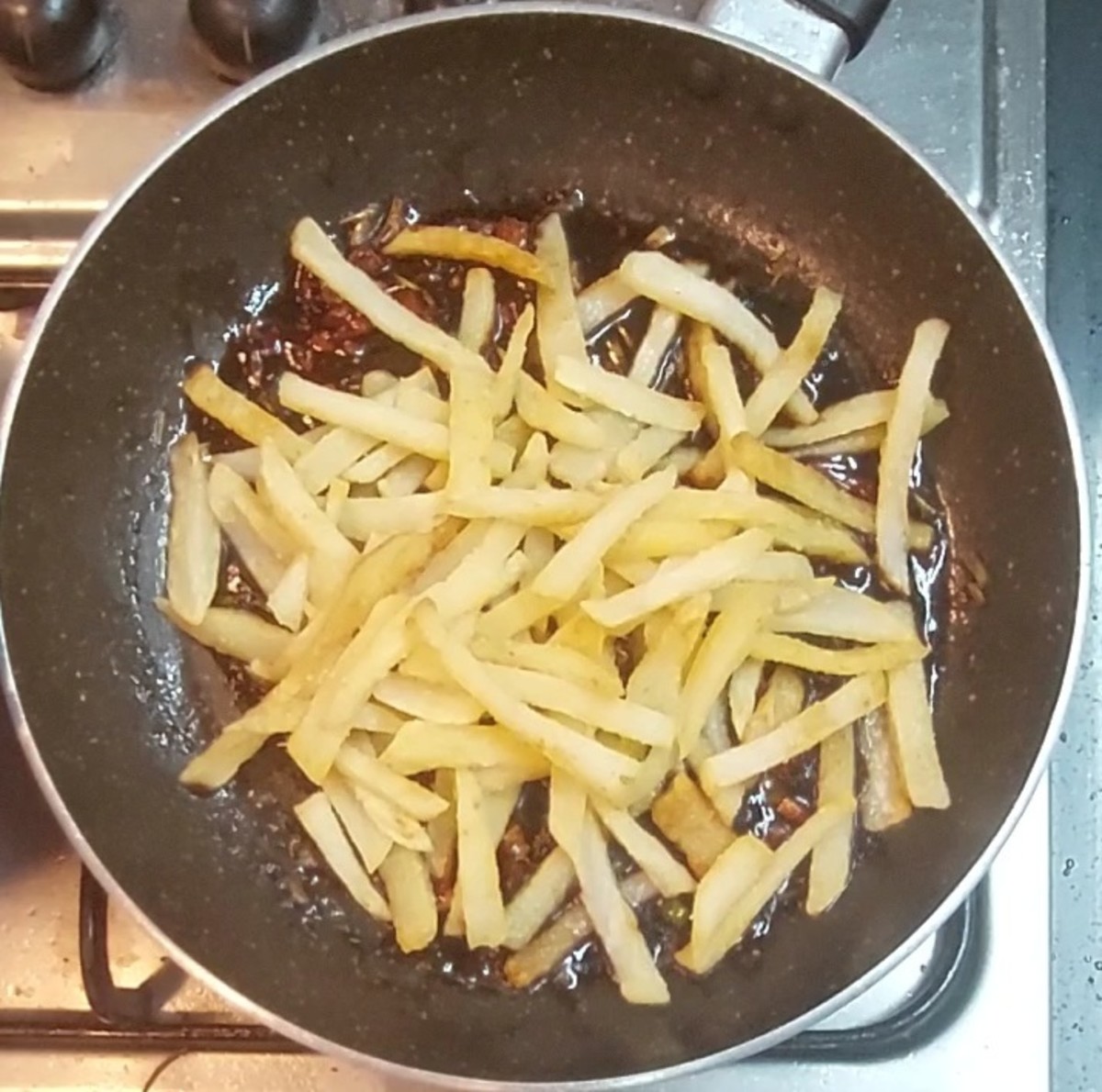 Add fried potatoes.