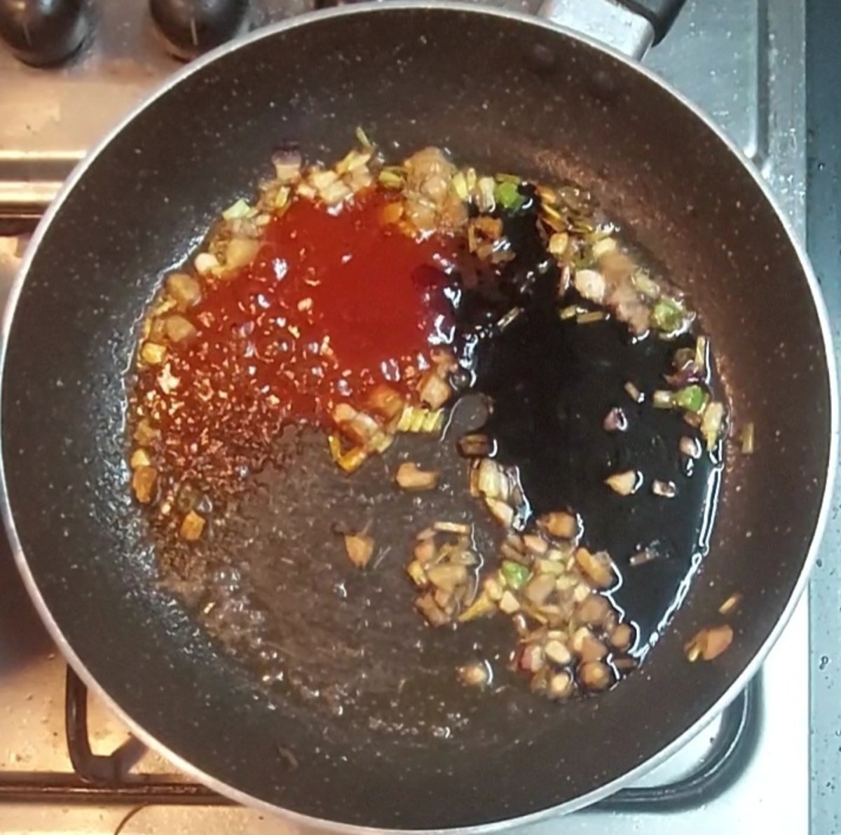 Add 2 tablespoons tomato sauce and 2 tablespoons soy sauce. Mix well.