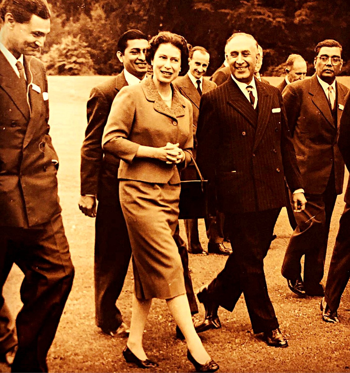 The Queen (pictured here with Pakistani nuclear scientists in 1960) wore practical heels throughout her reign because she was on her feet a lot and comfort was a must.