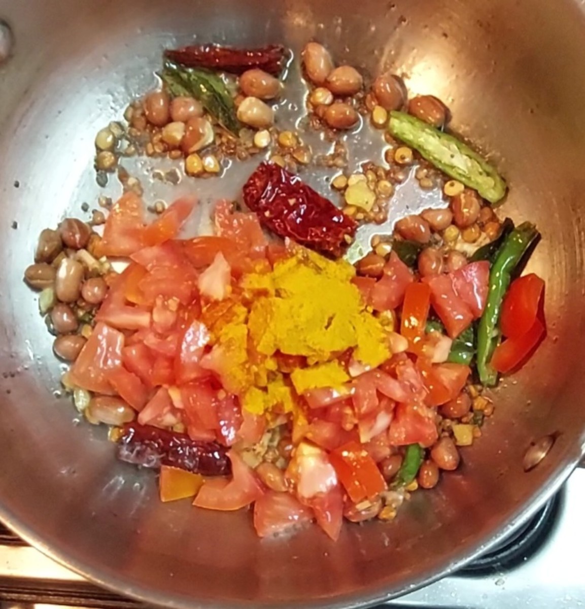 Add 1-2 chopped tomatoes and 1/2 teaspoon turmeric powder.