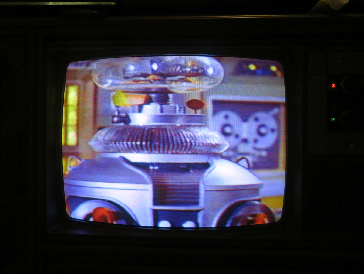 The Robot looking very Nice on the Quasar Color Console Television Model WL9439SP, Playing The Ghost Planet, Lost in Space, Columbia House VHS
