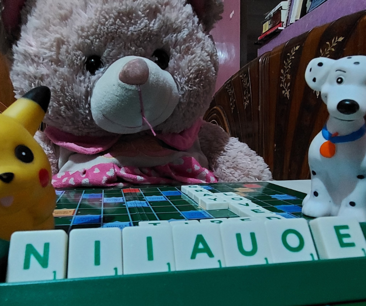 Chu-chu, Moqi, and Soqi, trying to convince the scrabble player to get rid of the vowels. 