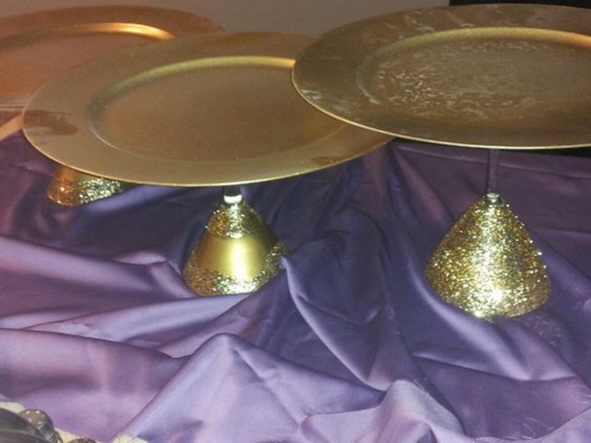 Dollar Store martini glasses 3 different sizes, charger plates, modge podge, glitter.....voila cake stands with pizzazz