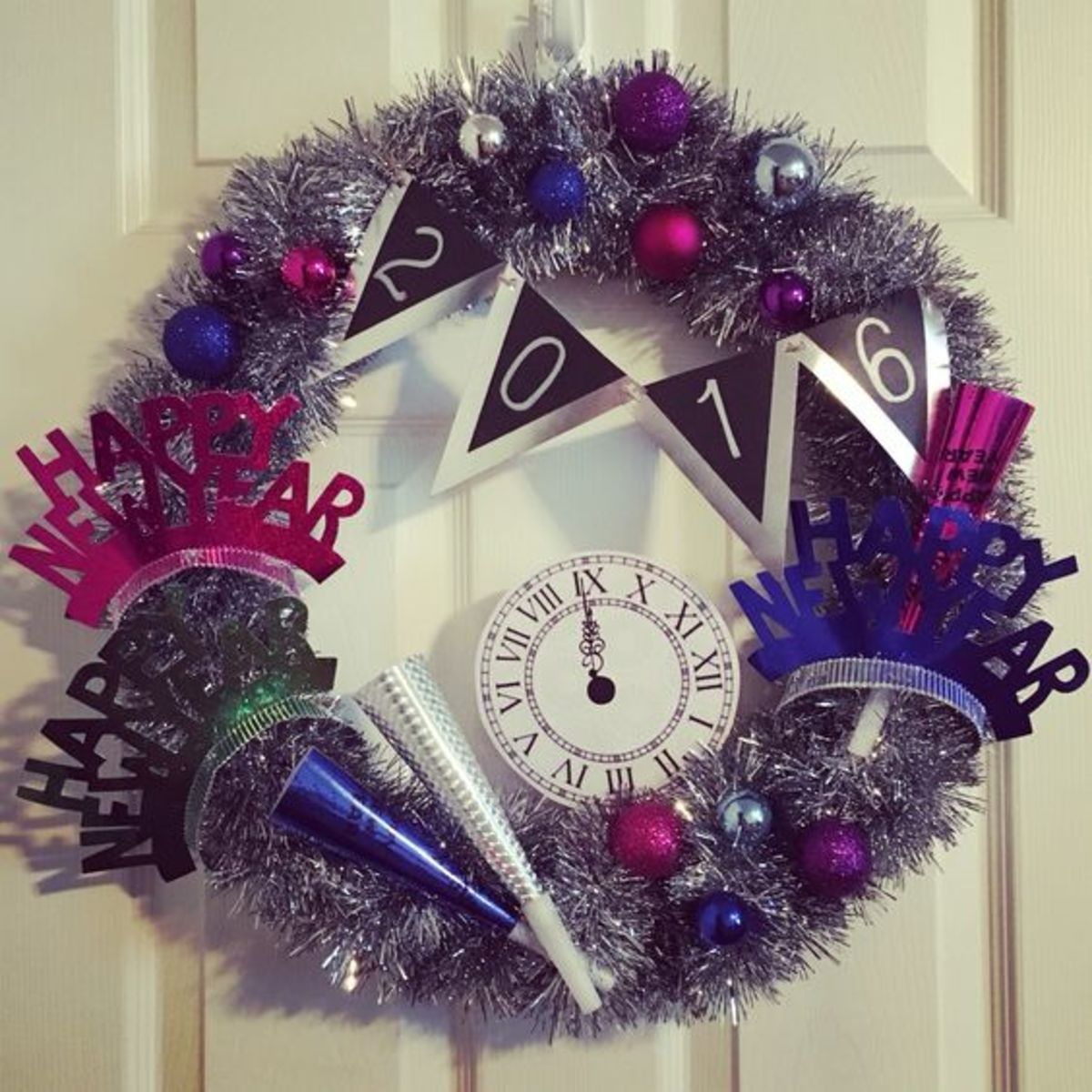 New Years wreath - use garland and ornaments,  New Years crowns and horns from the dollar store. A print out of a clock face .