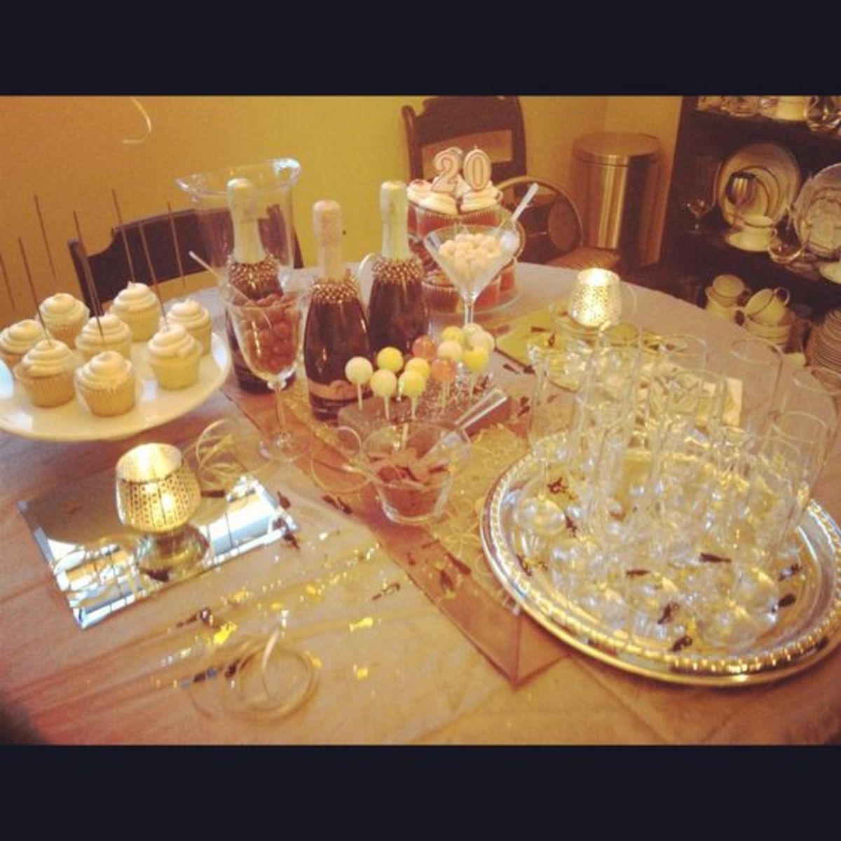 Dollar store- table cloth (curtain) runner, platters,champagne flutes, sparklers,lollipops,mirrors,candle holders bracelettes on the bubbly,napkins, curling ribbon and bottle and bubble confetti