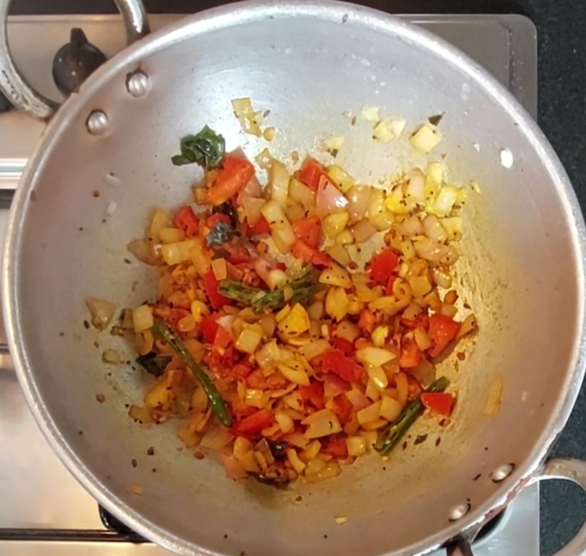 Add 1 chopped tomato and 1/2 teaspoon turmeric powder. Saute till tomato shrinks.