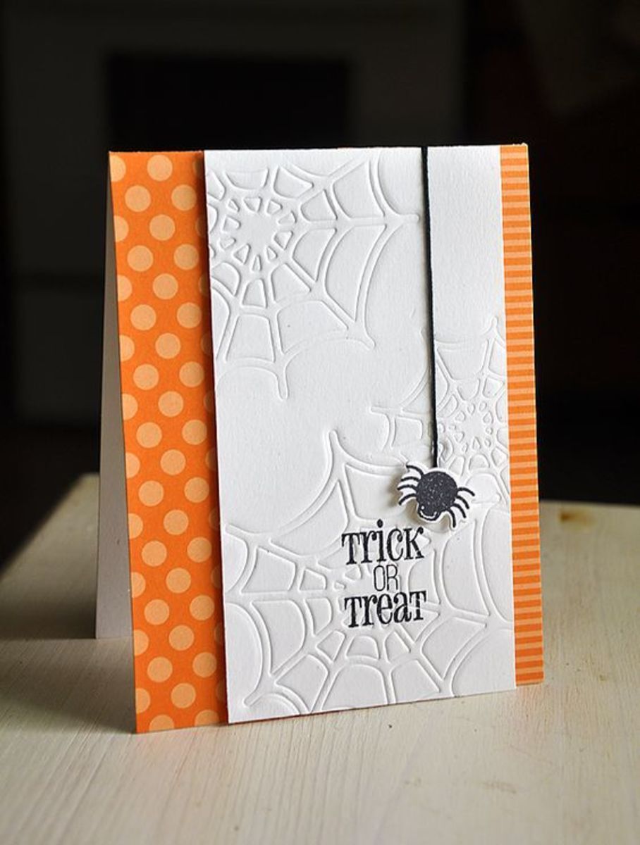 Partially embossed Halloween card with themed paper to continue the design. 