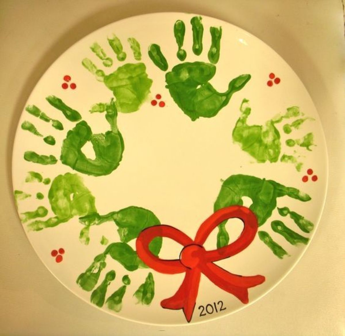 Handprint wreath painted pottery