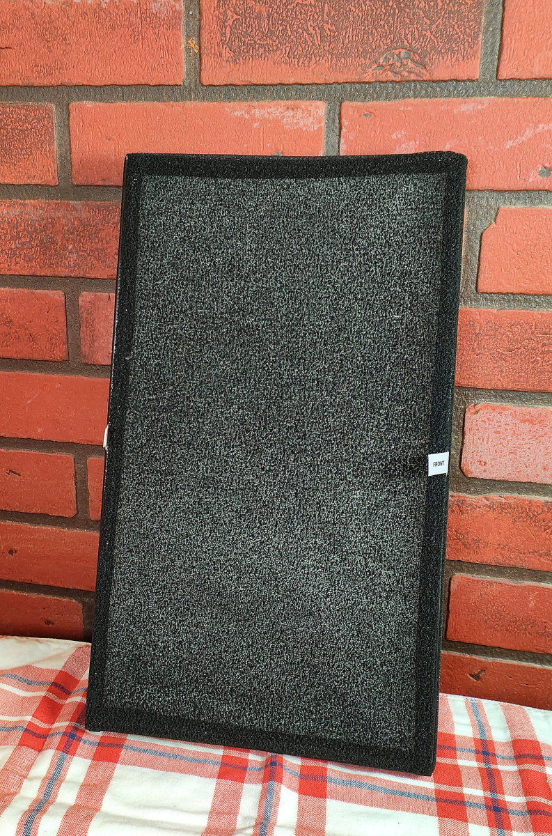 Front of HEPA filter, displaying the activated carbon component
