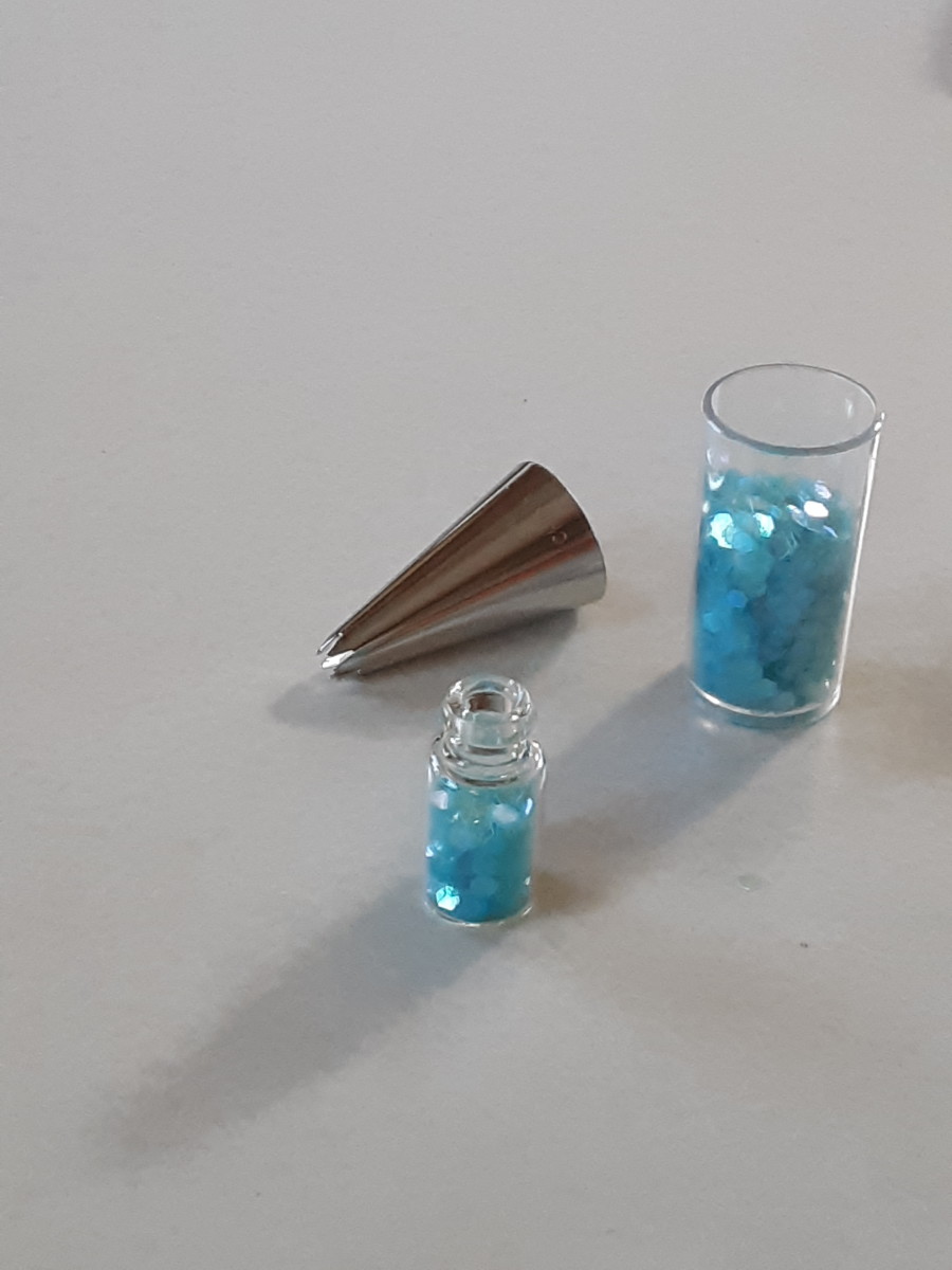 Spill Hexagon glitter into tiny bottle.
