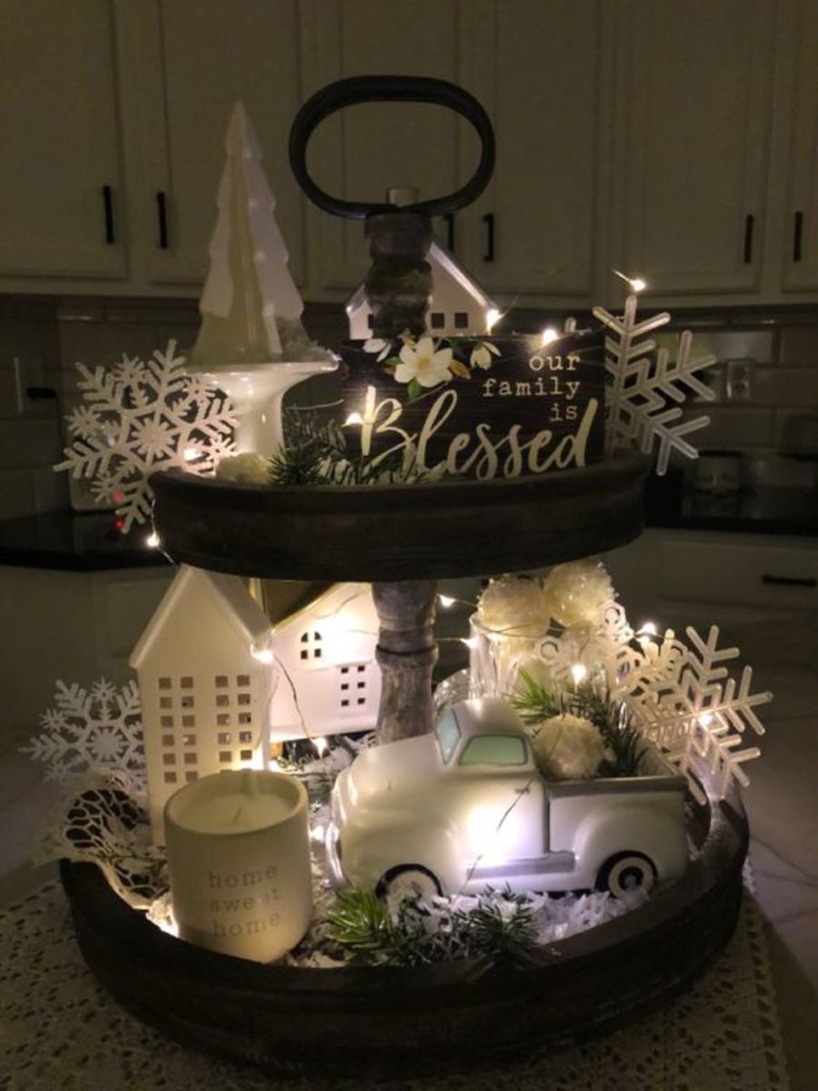 Snow and lights on a timer keep this tiered tray sparkling through January.