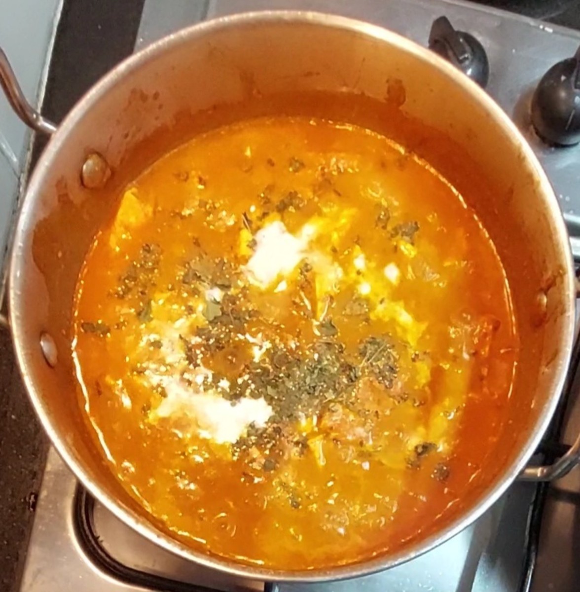 Add 1 teaspoon crushed kasuri methi (dry fenugreek leaves). Add salt if required. Add 2 tablespoons fresh cream, mix and combine well. Switch off the flame.