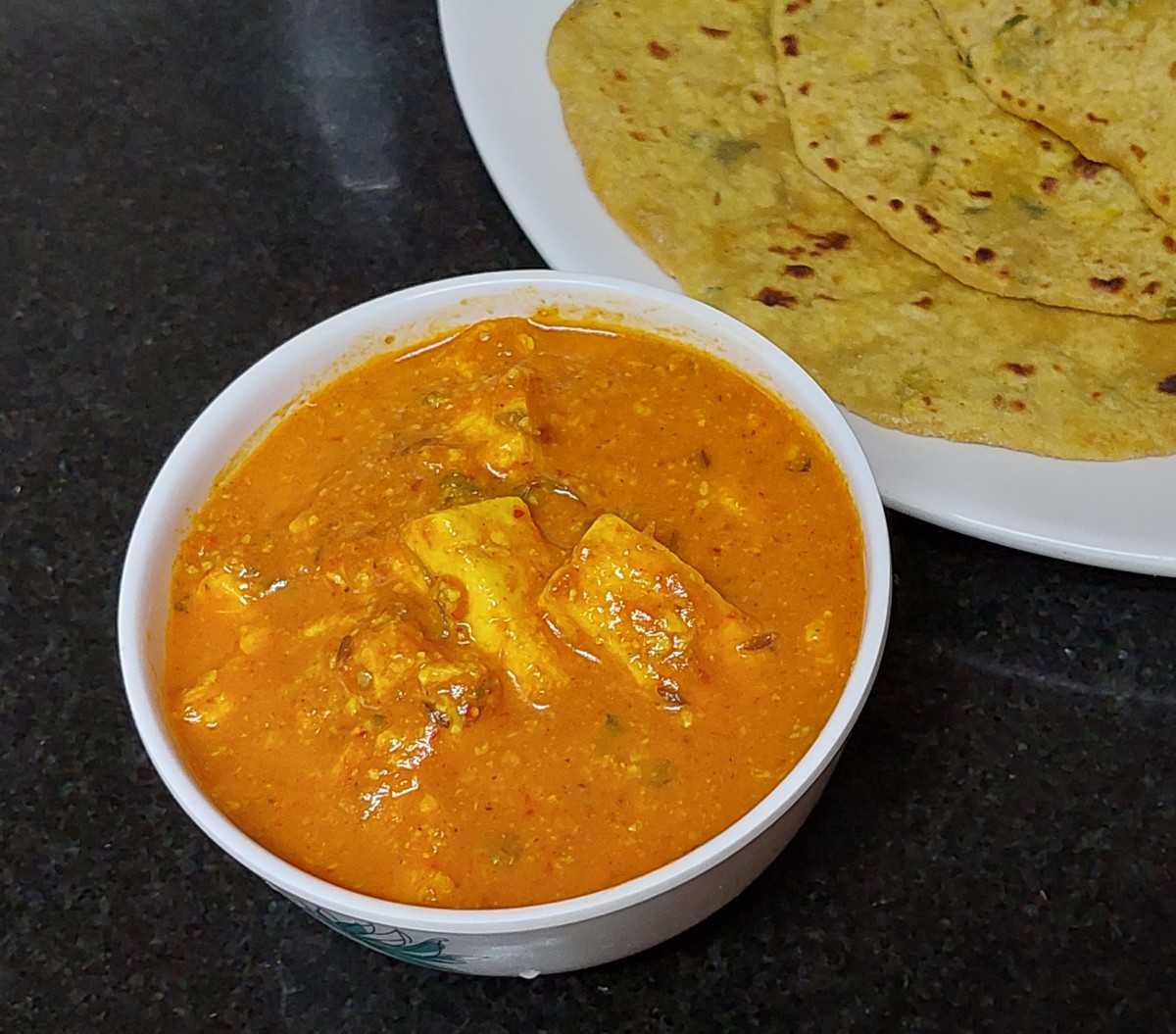 Garnish with grated paneer and cream. Serve hot with roti, paratha, chapati, naan, phulka or flavored rice. Enjoy!