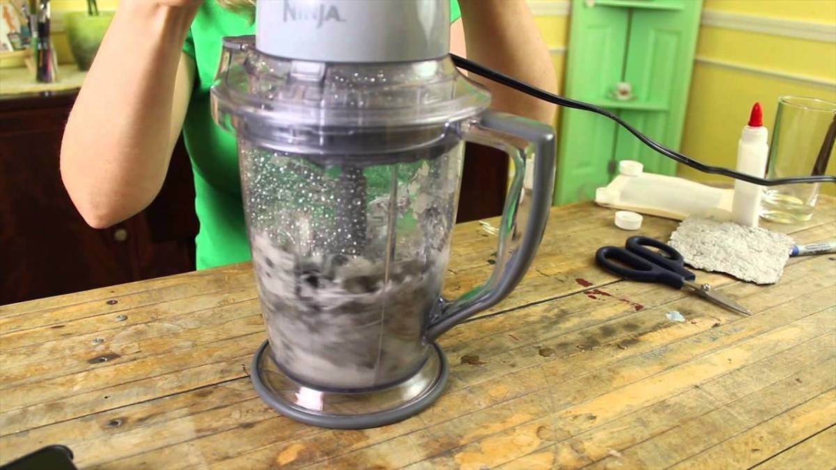 Torn up paper and lint is added into a blender with plenty of water.  It is then blended until smooth.