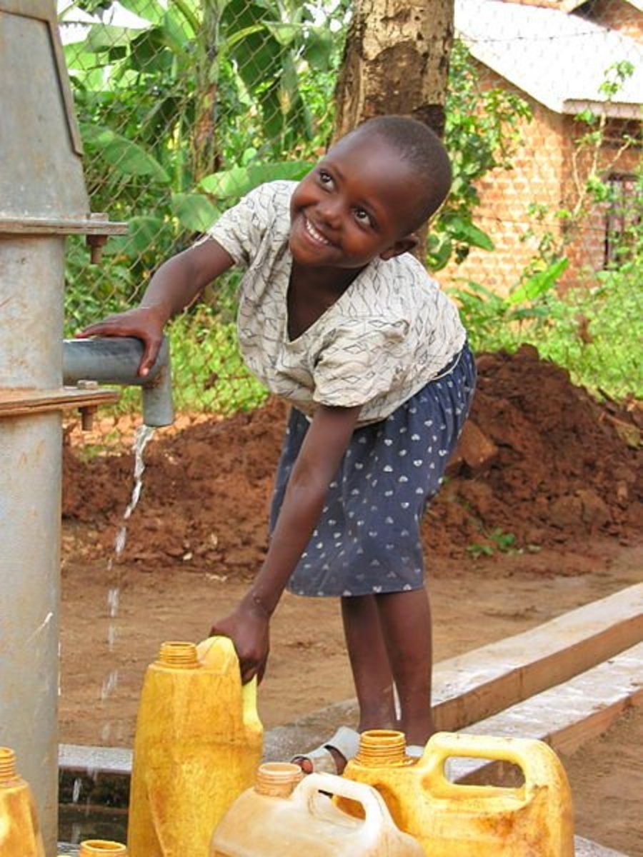 Outdoor spigot provides groundwater for village children in Uganda.