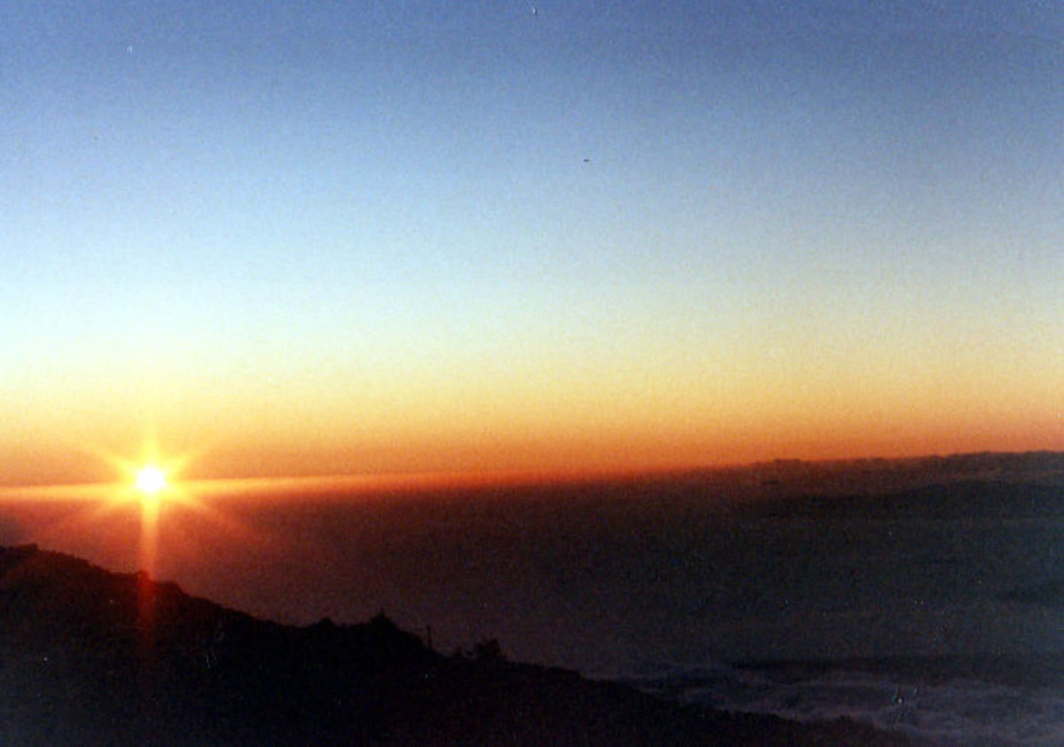 On top of the world at Haleakala, watching the sunrise. A must do activity for tourists!
