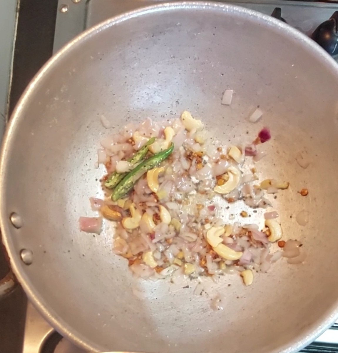 Add 1 chopped onion, 1 teaspoon ginger and 1-2 green chilies. Saute till onions turn translucent.