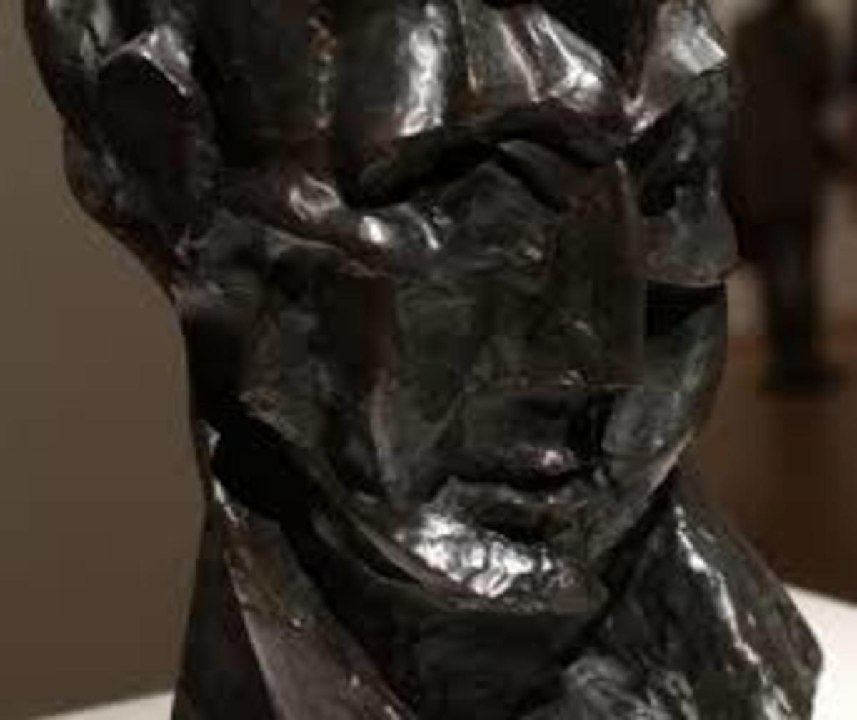 Head of a Woman (Fernande) 1909 Exaggerating the features and planes to heighten the effects of light and shadow wanted see how natural light interacts with his cubist surface.  Traditional bronze. 