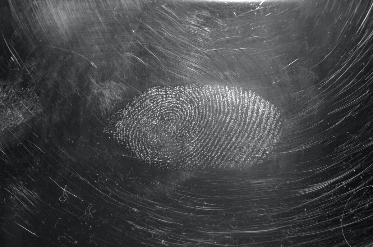 Fingerprint impression photography requires precision and technique.