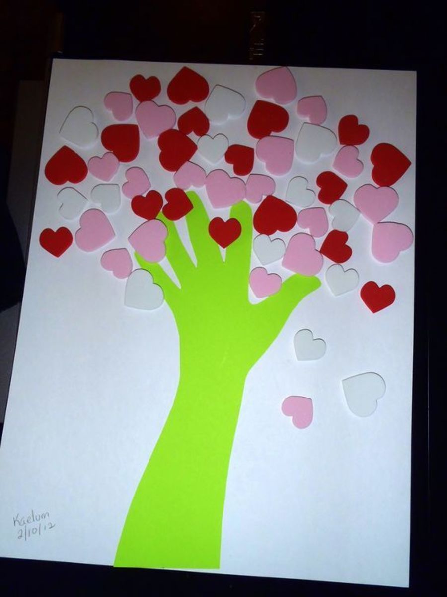Heart tree using hand print and foam heart stickers.