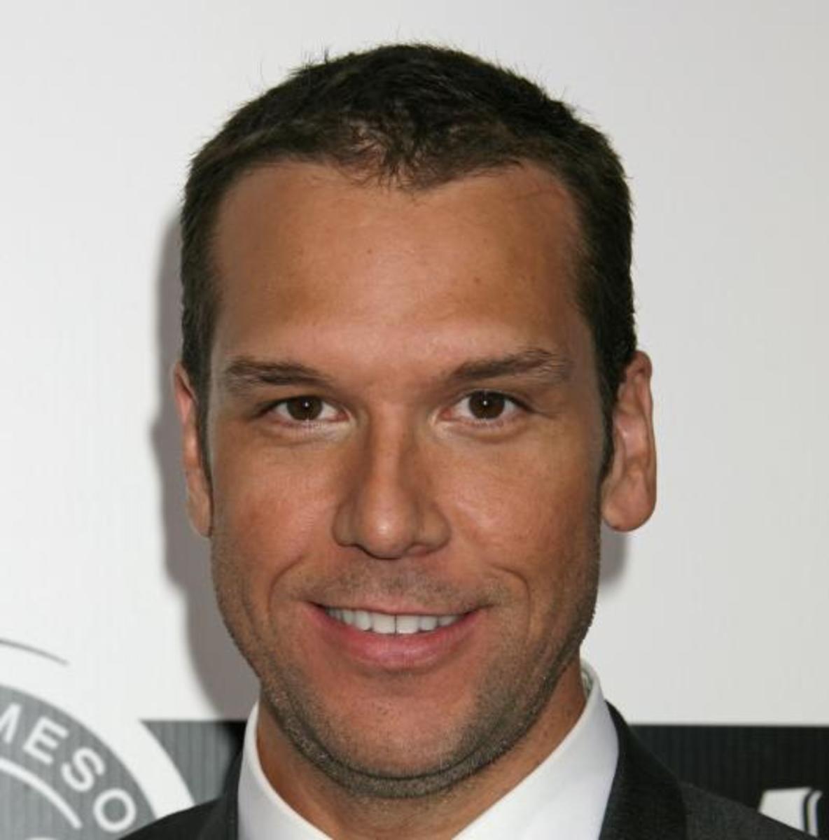 A smiling Dane Cook poses for a photo