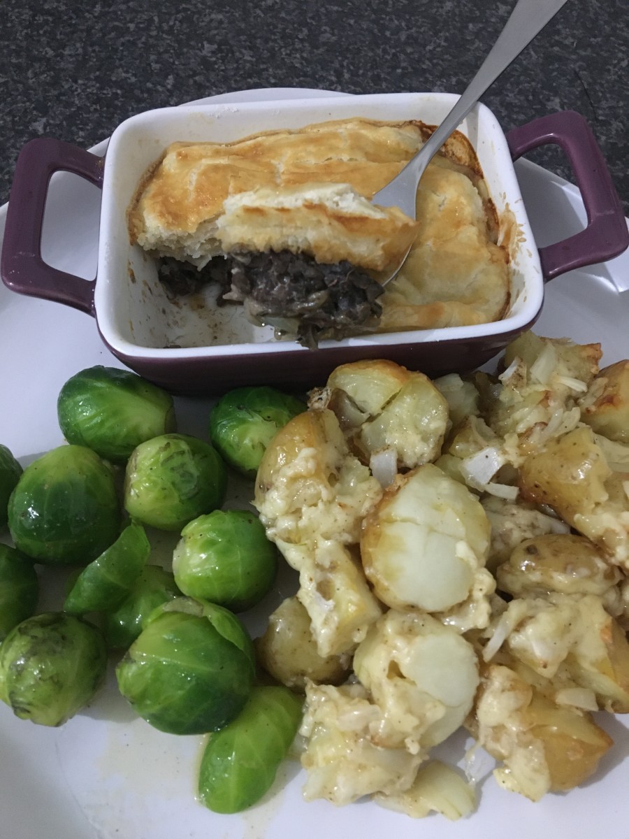 Pigeon and mushroom pie is served with mini cheese and onion roasties and sprouts
