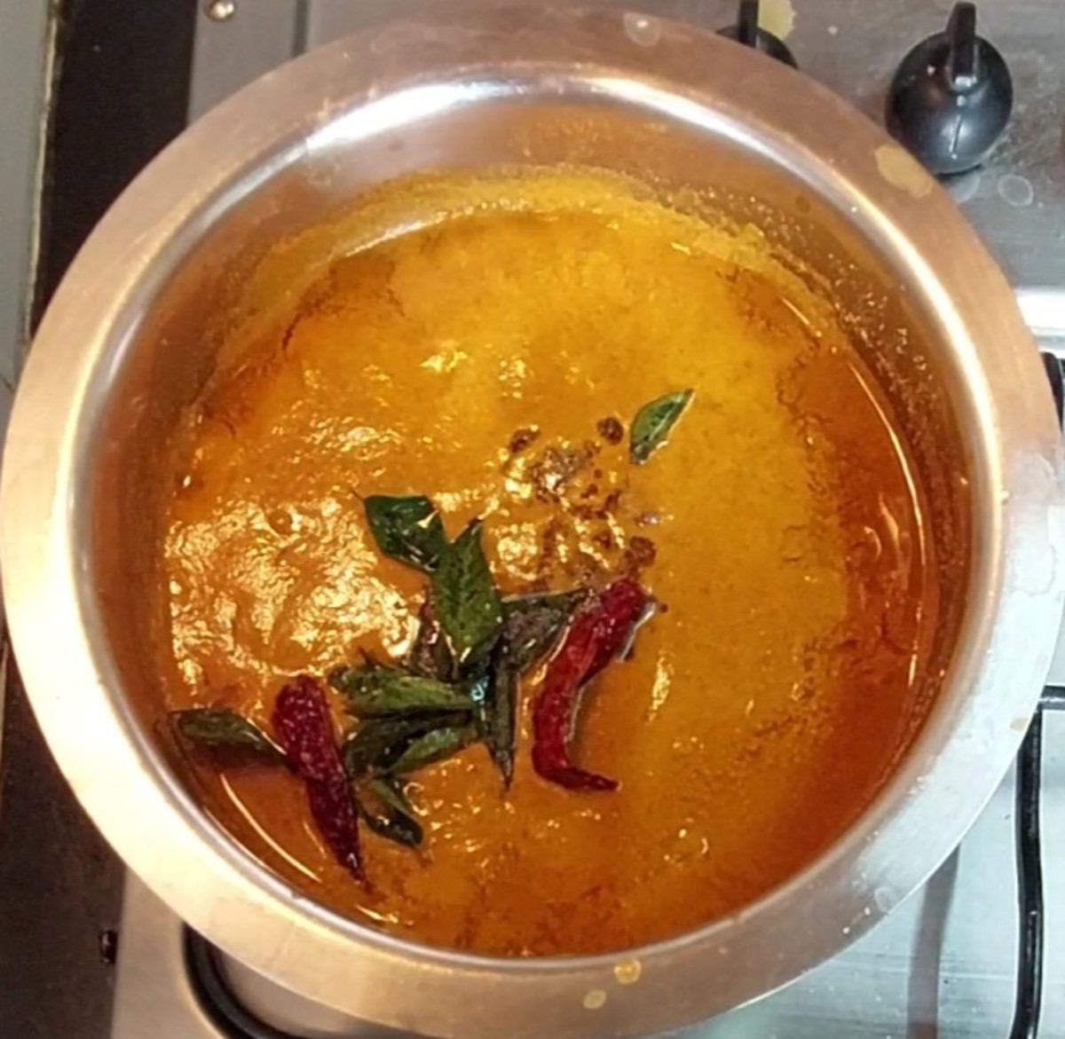 Add this tempering to the prepared sambar. Keep it covered for 2 minutes.