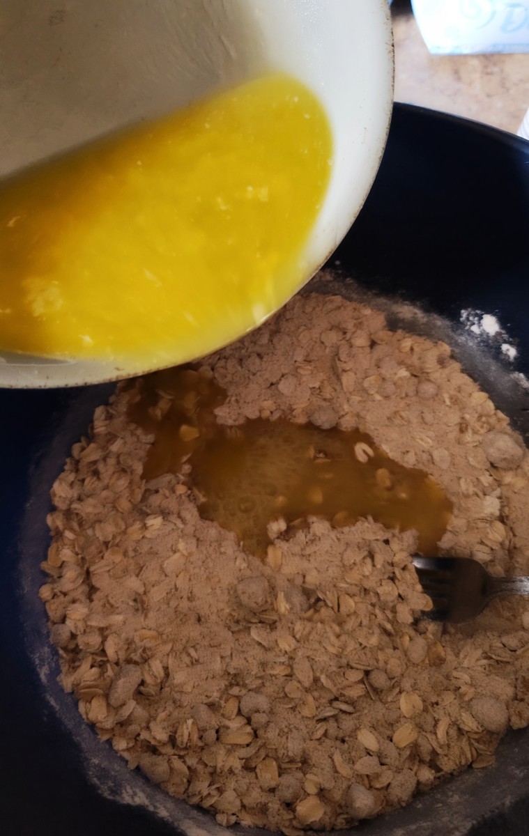 Slowly pour melted butter into topping mixture. 