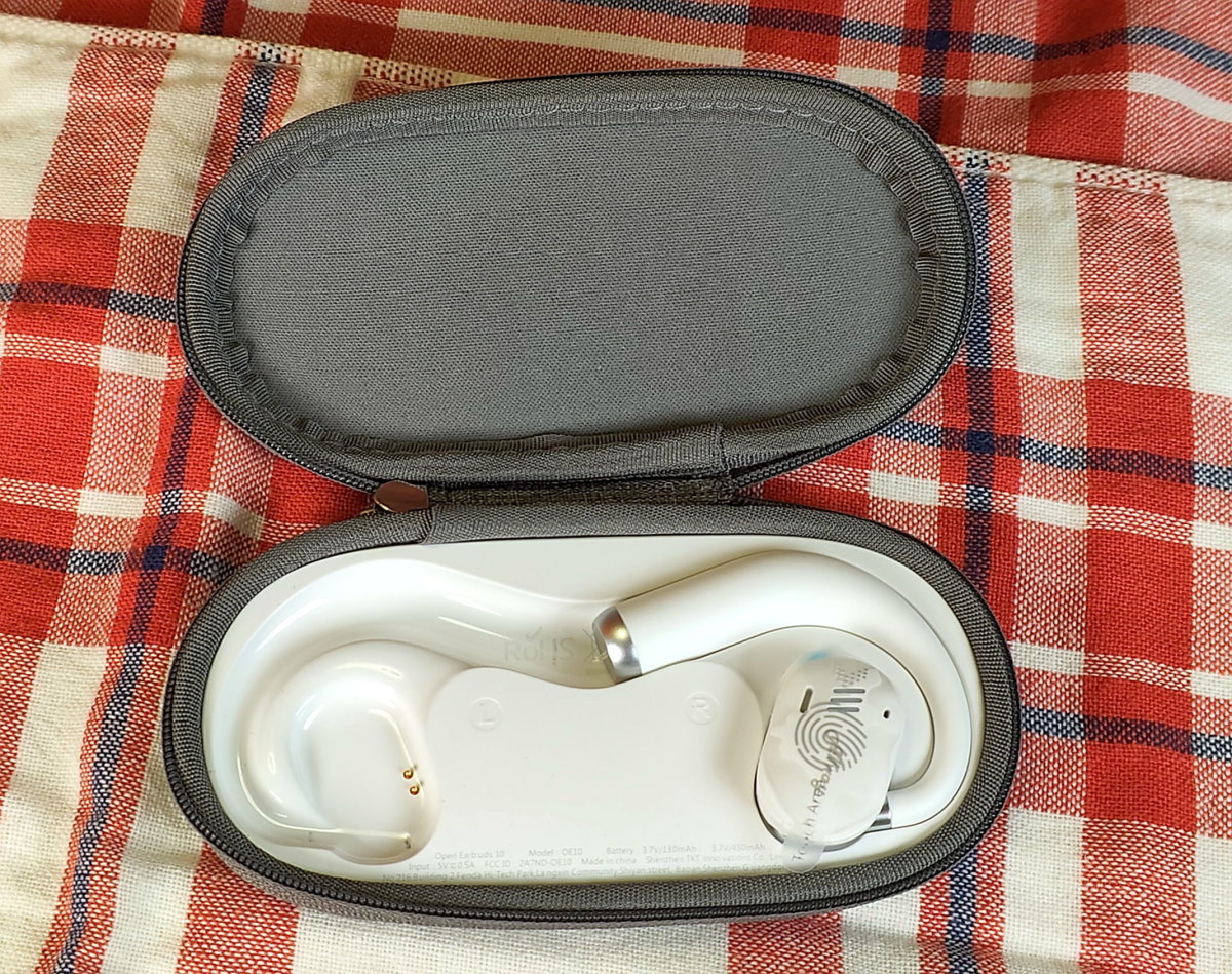 Charging case with one earbud removed