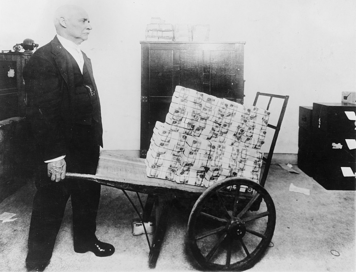 A man with a wheelbarrow of money. Your beliefs about inflation may be based on photographs like this.