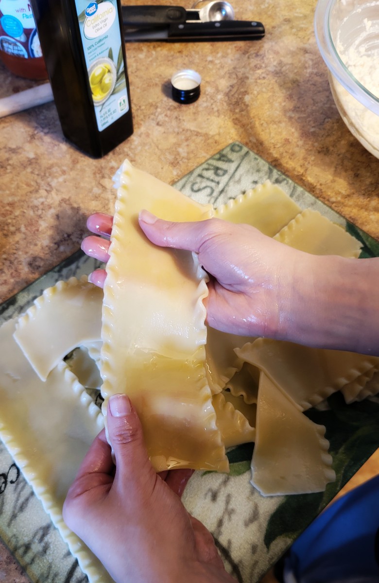As noodles finish cooking, place on a cutting board or cookie sheet. Coat hands with a little extra virgin olive oil and rub the oil onto each noodle.