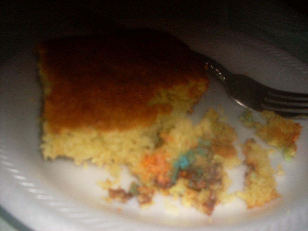A tasty slice of yellow cake with peanut M&Ms